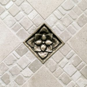 Foundry Art Lotus 3-inch metal accent inset tile with tumbled stone